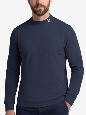 Upper body front view of model wearing navy warm brushed mock neck golf t shirt