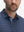 Front view from nose to chest of model wearing the dark blue golf club 4 way stretch print collared polo shirt, showcasing the upper fit