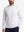 Upper body front view of model wearing white warm brushed mock neck golf t shirt