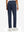 Back lower body view of model wearing the navy women's lightweight high waisted golf pants, highlighting the rear design
