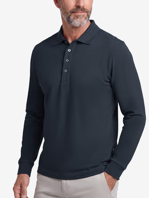 Front upper body shot of model wearing dark navy solid stretch cotton pique long sleeve polo shirts