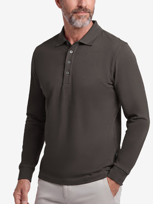 Front upper body shot of model wearing dark brown solid stretch cotton pique long sleeve polo shirts