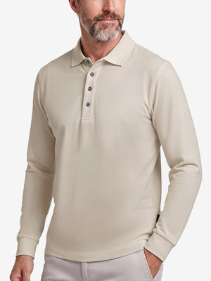 Front upper body shot of model wearing light khaki solid stretch cotton pique long sleeve polo shirts