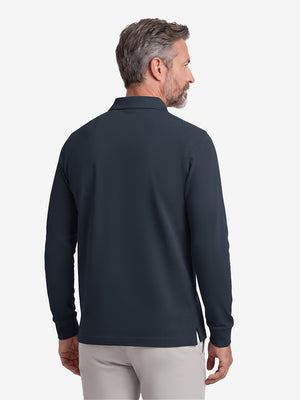 Back upper body shot of model wearing dark navy solid stretch cotton pique long sleeve polo shirts