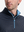 Close-up front view from nose to chest of model wearing navy flower  full print quarter zip sleeveless vest pullover