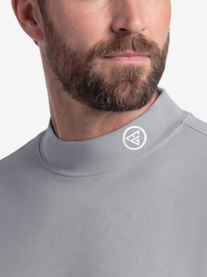 Front shot from nose to chest of model wearing grey warm brushed mock neck golf t shirt