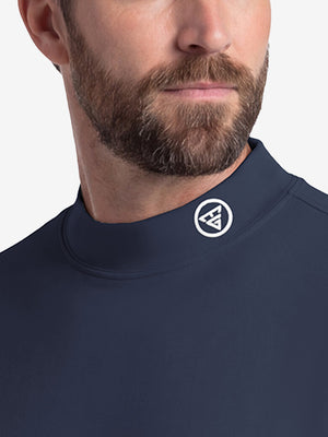Front shot from nose to chest of model wearing navy warm brushed mock neck golf t shirt