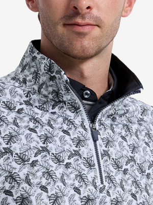 Close-up front view from nose to chest of model wearing black grey leaf1 full print quarter zip sleeveless vest pullover