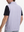 Back upper body shot of model wearing colorful hexagon full print quarter zip sleeveless vest pullover