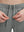 Detail view of elastic waistband on iron grey 4 way stretch breathable workout athletic shorts