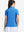 Back upper body shot of model wearing sky blue women's 5 buttons collared polo shirts