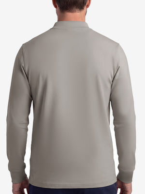 Back upper body shot of model wearing sand warm brushed mock neck golf t shirt