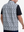 Back upper body shot of model wearing black grey leaf1 full print quarter zip sleeveless vest pullover