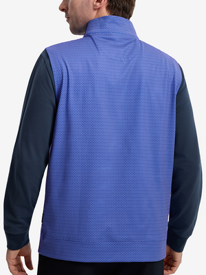 Back upper body shot of model wearing cobalt wave full print quarter zip sleeveless vest pullover