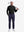 Front full body shot of model wearing black warm brushed mock neck golf t shirt with golf club resting on shoulder