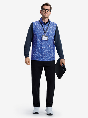 Front full body shot of model wearing line animal full print quarter zip sleeveless vest pullover while holding a folder in one hand