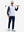 Front full body shot of model wearing grey irregular shape full print quarter zip sleeveless vest pullover with a golf club resting on shoulder