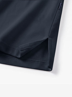 Detail view of hem on navy solid stretch cotton pique long sleeve polo shirts