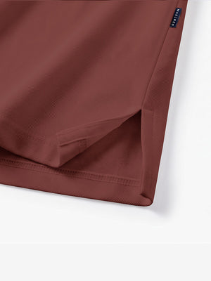 Detail view of hem on wine solid stretch cotton pique long sleeve polo shirts
