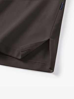 Detail view of hem on dark brown solid stretch cotton pique long sleeve polo shirts