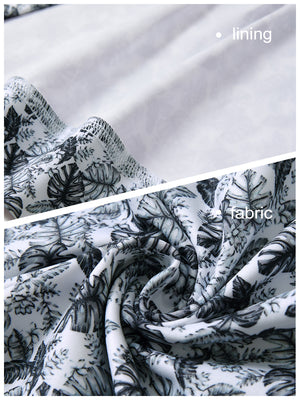 Close-up view of black grey leaf1  full print quarter zip sleeveless vest pullover showing inner lining and outer fabric  details