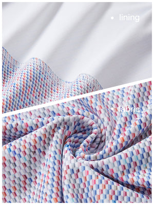 Close-up view of colorful hexagon full print quarter zip sleeveless vest pullover showing inner lining and outer fabric  details