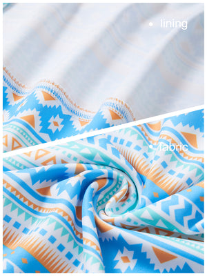 Close-up view of blue ethnic   full print quarter zip sleeveless vest pullover showing inner lining and outer fabric  details