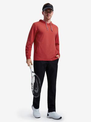 Front full body shot of model wearing red soft stretchy hoodie with inner print hood while holding a racket in one hand