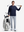 Front full body shot of model wearing navy soft stretchy hoodie with inner print hood, carrying a golf club on shoulder with one hand and resting the other hand on golf bag