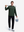 Front full body shot of model wearing forest green soft stretchy hoodie with inner print hood, carrying a golf club on shoulder with one hand and holding a basket of golf balls in the other hand