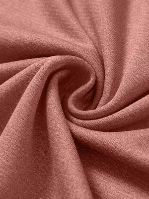 Close-up texture of  brick melange  lightweight sleeveless quarter zip golf vest fabric showing detailed premium material and weave