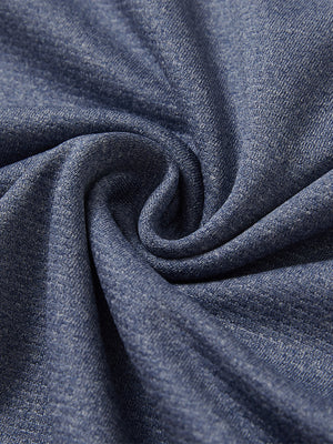 Close-up texture of  colony blue melange lightweight sleeveless quarter zip golf vest fabric showing detailed premium material and weave