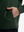 Close-up view of forest green soft stretchy hoodie with inner print hood outer pocket detail