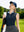 Front upper body shot of model wearing navy women's athletic quarter zip tank tops, carrying a bag on back and looking upward on the golf course